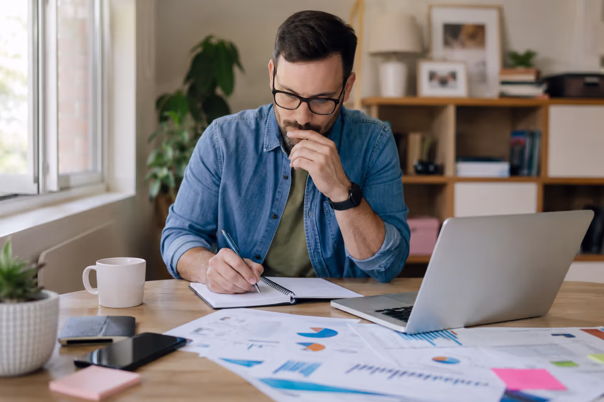 Entrepreneur planning a new small business launch and startup strategy from a home office